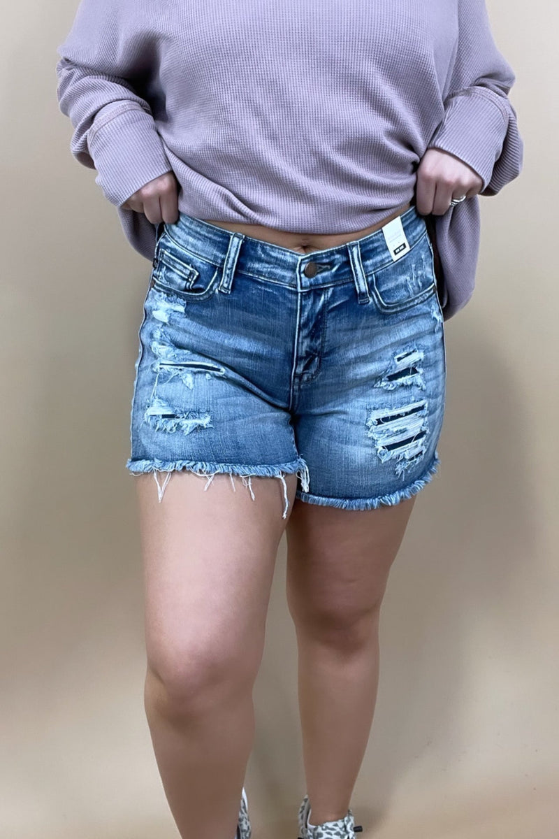 The Greta's- Mid Rise Light Wash Denim Shorts w/ Patched Distress Detail
